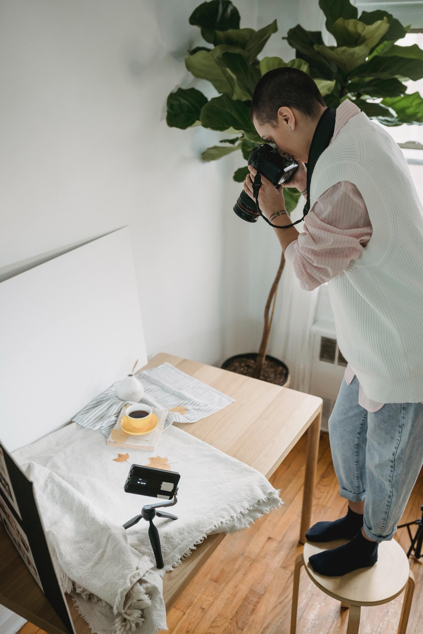 Creator photographing product flatlay for their new brand