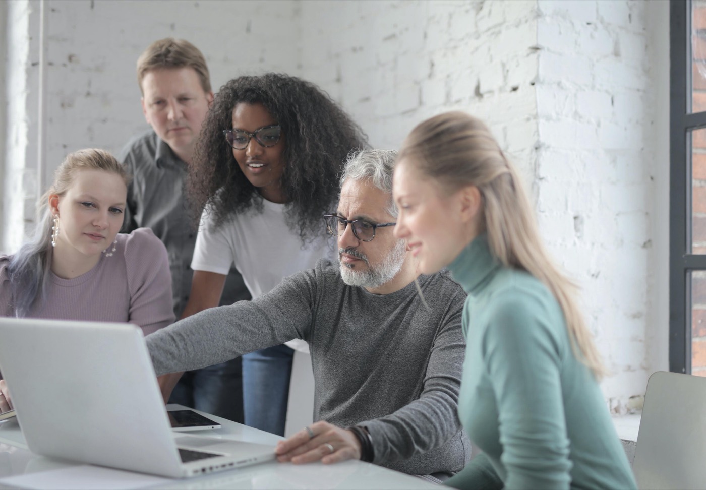 A small team reviewing brand documents together
