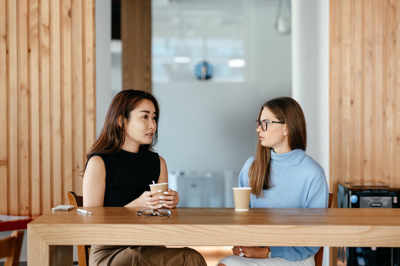 Two business owners meeting over coffee